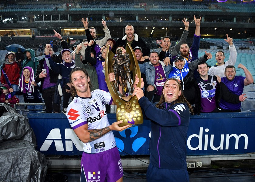 Falcons teammates Nicho Hynes and Aaron Booth celebrate the 2020 premiership.