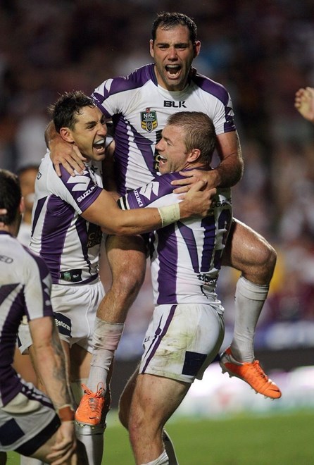 Cameron Smith celebrates with team mates after kicking the winning drop goal in golden point extra time : NRL Rugby League - Round 1. Manly-Warringah Sea Eagles V Melbourne Storm at Brookvale Oval Saturday the 8th of March 2014 . Digital Image by Robb Cox nrlphotos.com