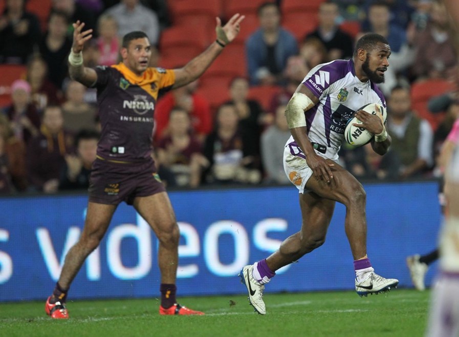 Photo by Colin Whelan copyright © nrlphotos.com :     Marika Koroibete gets away from an appealing Justin Hodges                          NRL Rugby League, Round 20 Brisbane Broncos v Melbourne Storm at Suncorp Stadium, Friday July 25th 2014.