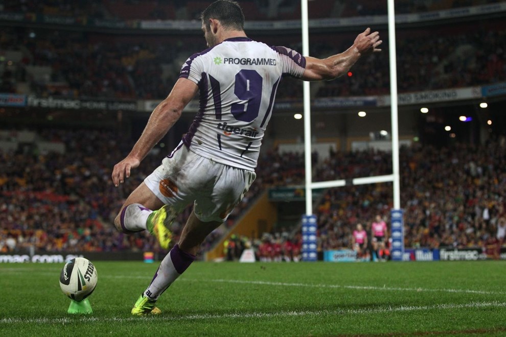 Photo by Colin Whelan copyright © nrlphotos.com :       Cameron Smith kicks from the touchline                        NRL Rugby League, Round 20 Brisbane Broncos v Melbourne Storm at Suncorp Stadium, Friday July 25th 2014.