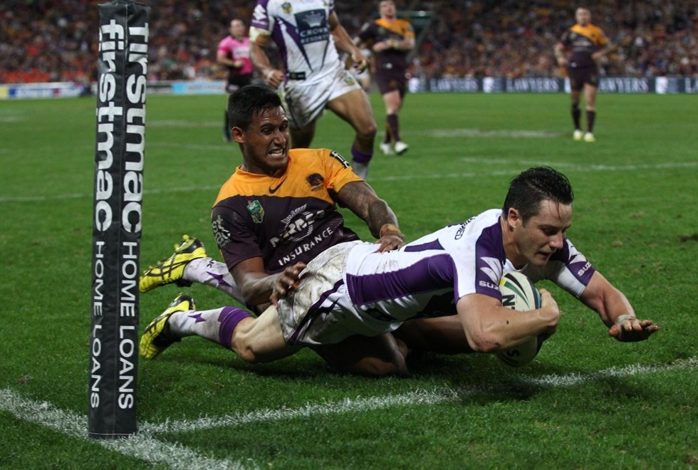 Photo by Colin Whelan copyright © nrlphotos.com :     Cooper Cronk beats Ben Barba to score in the corner                          NRL Rugby League, Round 20 Brisbane Broncos v Melbourne Storm at Suncorp Stadium, Friday July 25th 2014.