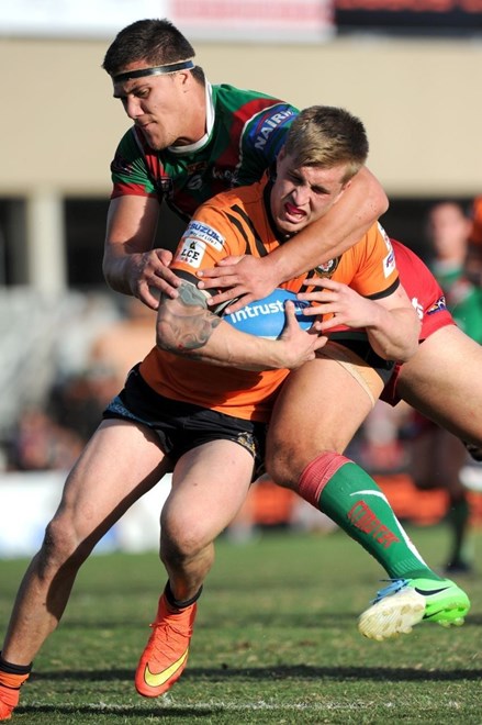 Cameron Munster shrugs off a tackle in the Queensland Cup.