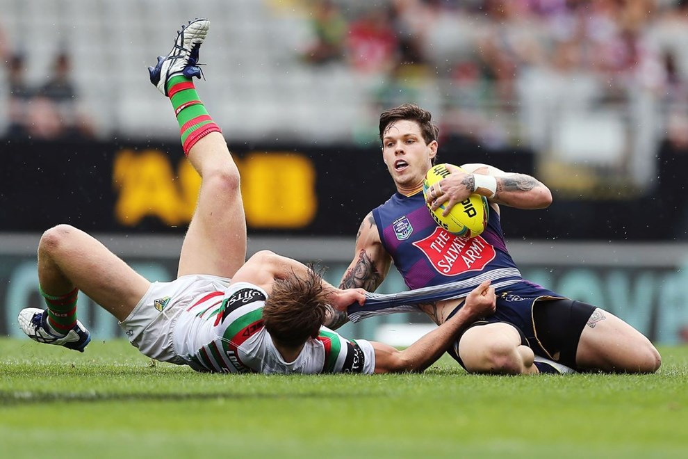 Ben Hampton of the Storm is tackled by Cameron McInnes of the Rabbitohs during Day 2 of the NRL Auckland Nines Rugby League Tournament, Eden Park, Auckland, New Zealand. Sunday 1 February 2015. Copyright Photo: Anthony Au-Yeung / www.photosport.co.nz