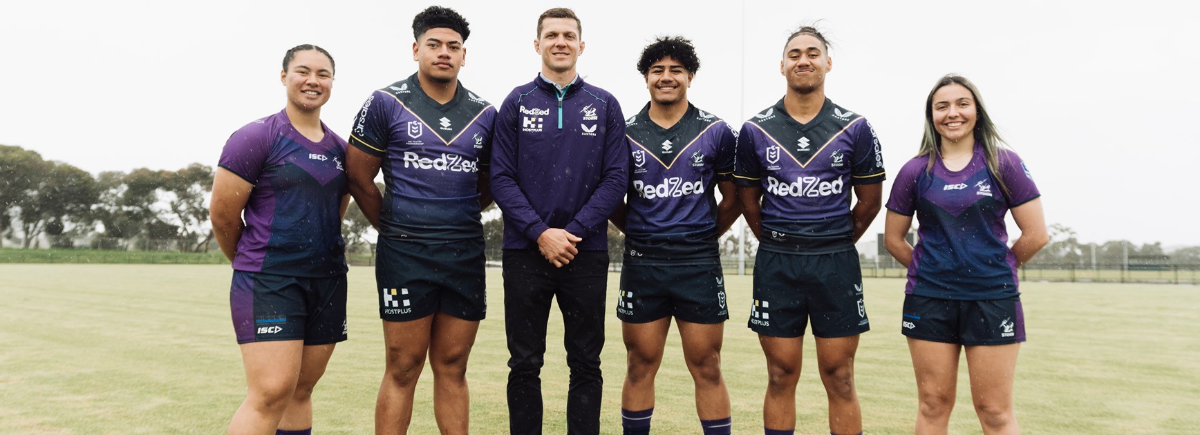 Member for Broadmeadows, Frank McGuire, Hume City Council Deputy Mayor, Cr. Sam Misho, and Cr. Jack Medcraft, with Melbourne Storm male and female junior representative players.
